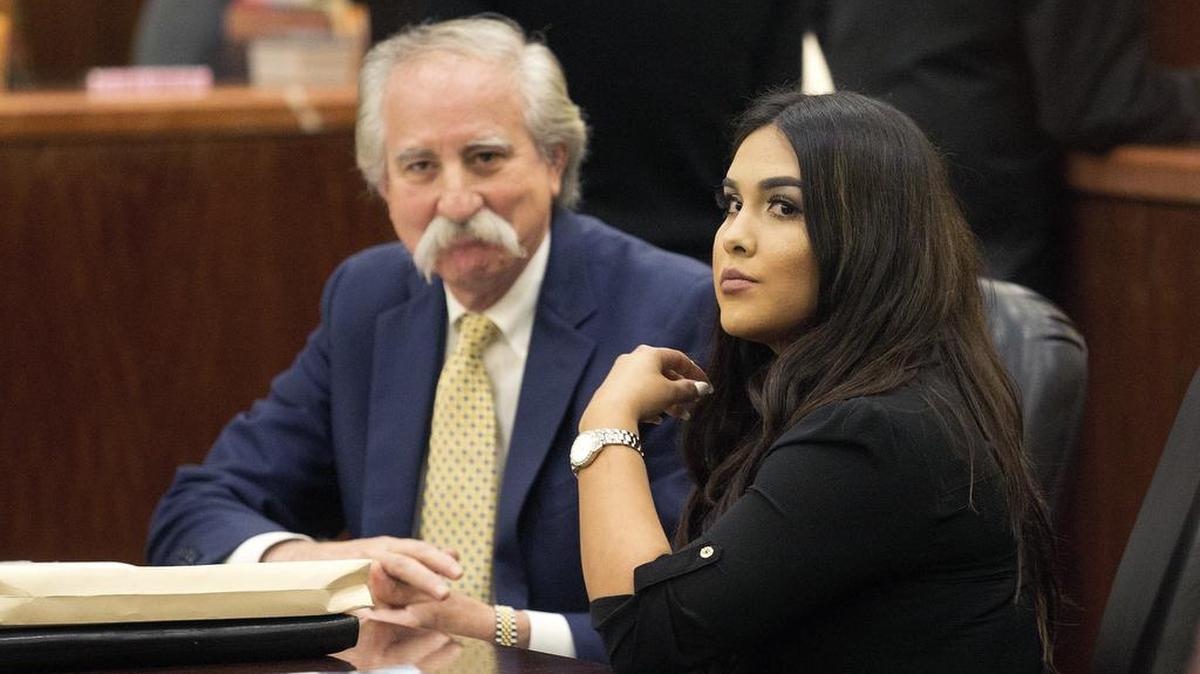 Alexandria Vera, a former Houston-area middle school teacher, sits with attorney Ricardo Rodriguez as they wait for her hearing to begin, Friday, Jan. 13, 2017, in Houston. Vera, who pleaded guilty last year to having a long-term sexual relationship with a 13-year-old boy who impregnated her, was sentenced to 10 years in prison.