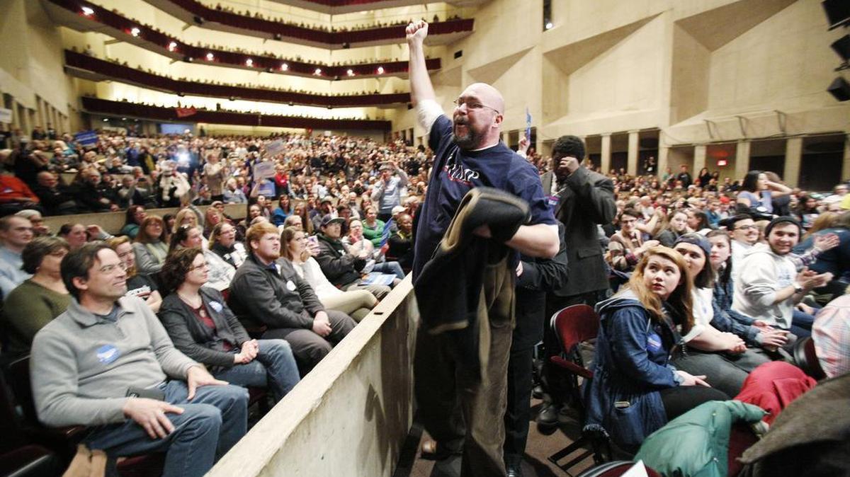 A Donald Trump supporter is escorted out of a rally featuring Democratic presidential candidate, Sen. Bernie Sanders, I-Vt., at UMass Amherst on Saturday in Amherst, Mass.