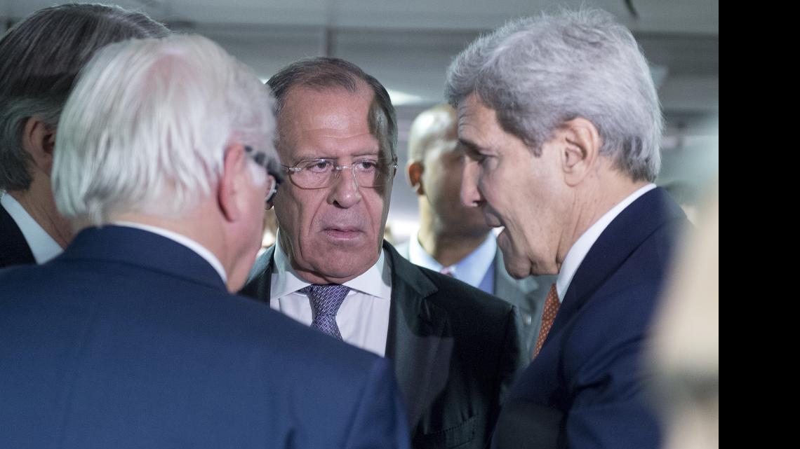 
German Minister for Foreign Affairs Frank-Walter Steinmeier, left, Russian Foreign Minister Sergey Lavrov, center, and US Secretary of State John Kerry talk prior to the last plenary session at the United Nations building in Vienna, Austria, Tuesday, July 14, 2015. After 18 days of intense and often fractious negotiation, diplomats Tuesday declared that world powers and Iran had struck a landmark deal to curb Iran's nuclear program in exchange for billions of dollars in relief from international sanctions, an agreement designed to avert the threat of a nuclear-armed Iran and another U.S. military intervention in the Muslim world. 
