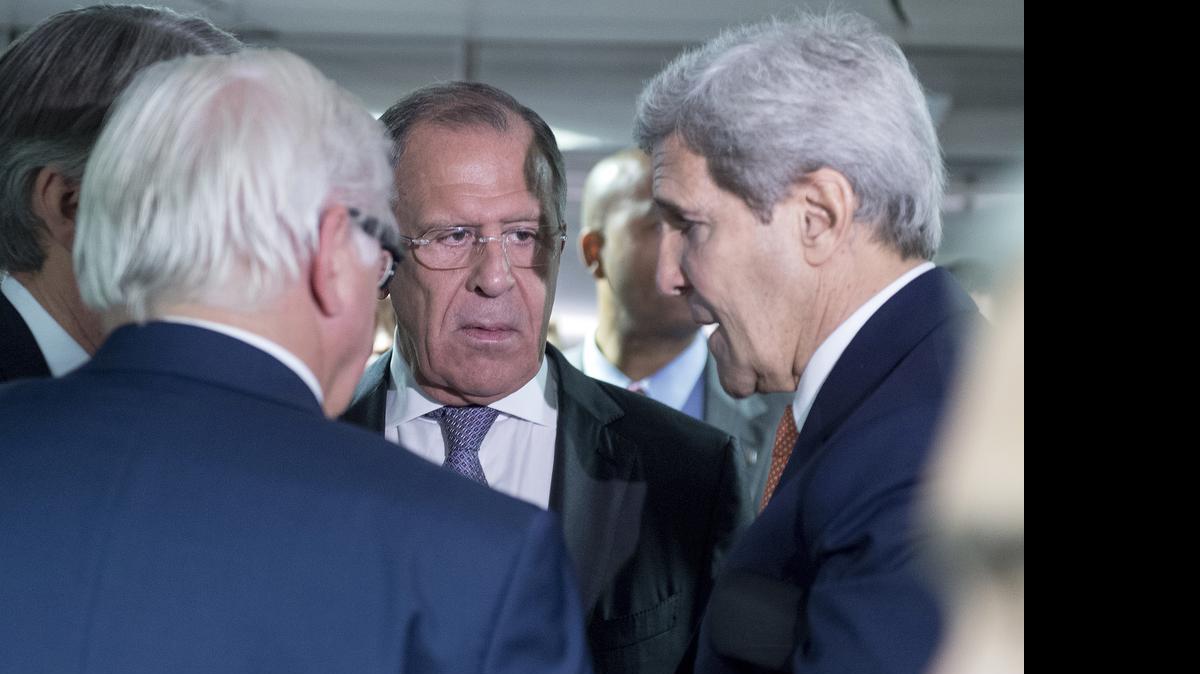 
German Minister for Foreign Affairs Frank-Walter Steinmeier, left, Russian Foreign Minister Sergey Lavrov, center, and US Secretary of State John Kerry talk prior to the last plenary session at the United Nations building in Vienna, Austria, Tuesday, July 14, 2015. After 18 days of intense and often fractious negotiation, diplomats Tuesday declared that world powers and Iran had struck a landmark deal to curb Iran's nuclear program in exchange for billions of dollars in relief from international sanctions, an agreement designed to avert the threat of a nuclear-armed Iran and another U.S. military intervention in the Muslim world. 

