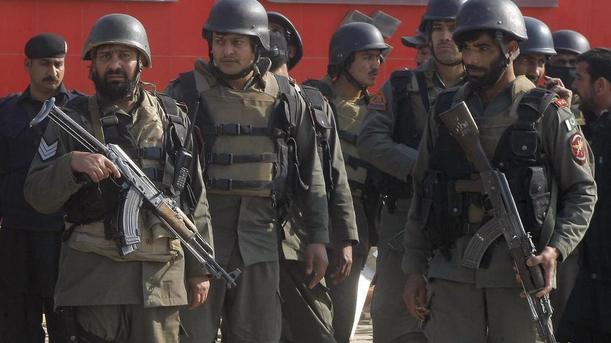Pakistani troops arrive at Bacha Khan University in Charsadda on Wednesday after gunmen stormed the school.