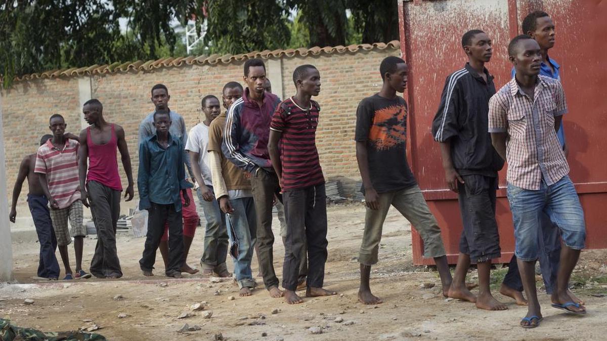 Men captured by the security forces, who were said by them to have been involved in Friday's attacks on military targets but which could not be independently verified, are paraded during a press conference at the country's intelligence service headquarters in the capital Bujumbura, Burundi, Dec. 12, 2015. Violence from coordinated attacks on three army installations killed 87 people, an army spokesman said.
