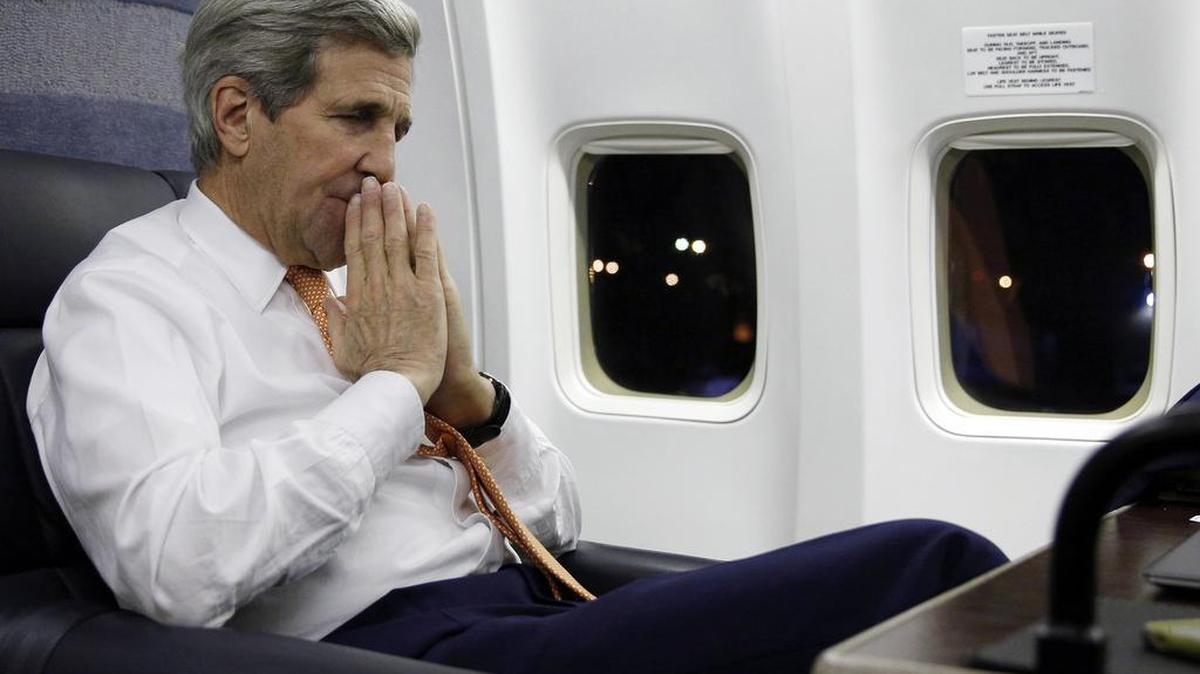 U.S. Secretary of State John Kerry speaks on Sunday, Jan. 17, 2016, to journalists about his negotiations with Iran upon his arrival from Vienna at Andrews Air Force Base, Md. The Americans imprisoned by Iran began their journey home Sunday, their friends and family awaiting emotional reunions, after delicate diplomatic negotiations that played out