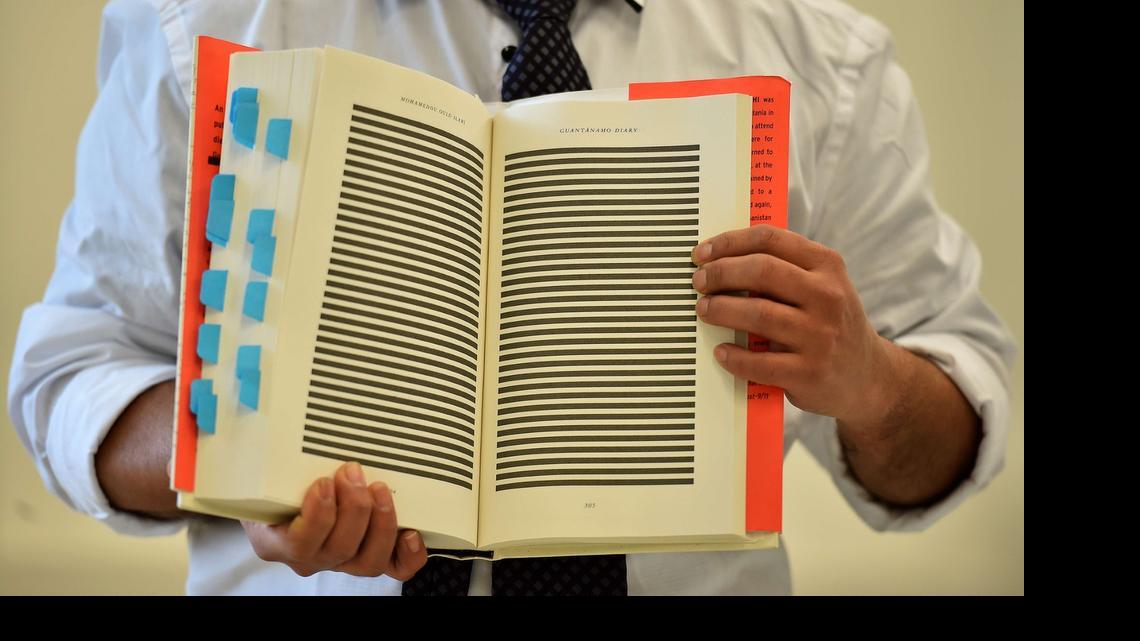 
The younger brother of Mohamedou Ould Slahi, Yahdih Ould Slahi, with a copy of Mohamedou's prison memoir. 
