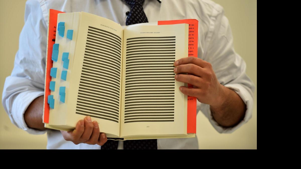 
The younger brother of Mohamedou Ould Slahi, Yahdih Ould Slahi, with a copy of Mohamedou's prison memoir. 

