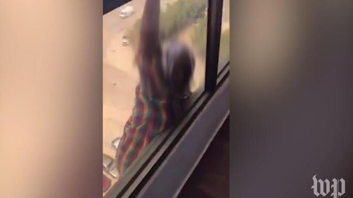 This screen grab is from a video of an Ethiopian maid dangling and eventually falling from a seventh-floor window, and was apparently filmed by her Kuwaiti employer. Human rights advocates say its just one example of widespread abuse of domestic workers across the Gulf.