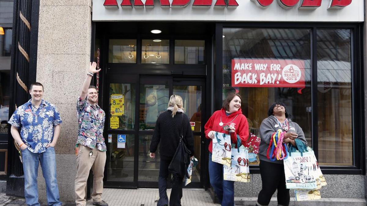 Employess greet people outside of Trader Joe's on Boylston Street in Boston, Wednesday, April 24, 2013.