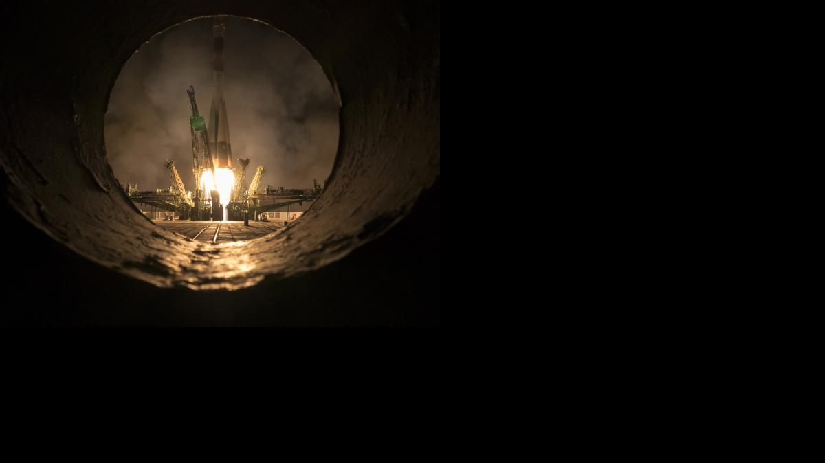 
Seen through part of the rocket transporter, the Soyuz-FG rocket booster with Soyuz TMA-16M space ship carrying a new crew to the International Space Station, ISS, blasts off at the Russian leased Baikonur cosmodrome, Kazakhstan, Saturday, March 28, 2015. The Russian rocket carries U.S. astronaut Scott Kelly, Russian cosmonauts Gennady Padalka, and Mikhail Korniyenko. 
