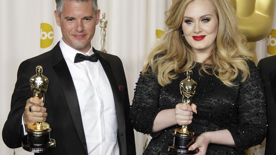 Adele Adkins and Paul Epworth hold their Oscar for Achievement in Music (Original Song) for the film “Skyfall” in the press room during the 85th annual Academy Awards in 2013. Her long-awaited album “25” has a final release date on XL/Columbia Records: Nov. 20.