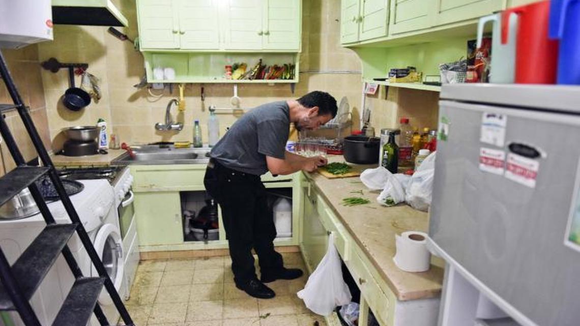 
Adel bin Muhammad El Ouerghi, from Tunisia, chops parsley in the home he shares with five other former Guantanamo detainees in Montevideo, Uruguay, on Feb. 25, 2015. El Ouerghi said he wants to open an Arab restaurant that would serve shwarma, kebobs and other traditional Middle Eastern foods, which he hasn’t found in Montevideo.
