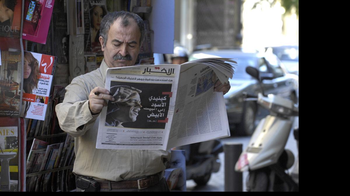 
 A man reads al-Akhbar newspaper covering Barack Obama’s victory in the U.S. presidential election with a banner headline “The Black Kennedy to the White House,” in Beirut, Lebanon, on Nov. 5, 2008. Saudi diplomatic correspondence published by the WikiLeaks group backs long-held suspicions the kingdom is using its oil wealth to buy influence with media and research centers across the Arab world. “Buying Silence” was the Saturday, June 20, 2015, headline in Beirut’s pro-Hezbollah Al-Akhbar daily, which is critical of Saudi Arabia, describing the revelations in the cables.
