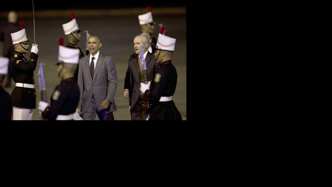 
President Barack Obama walks past the honor guard with Alvaro Aleman, Panama's Minister of Foreign Affairs, upon his arrival at the Tocumen international airport in Panama City, Panama, April 9, 2015, for the VII Summit of the Americas. 
