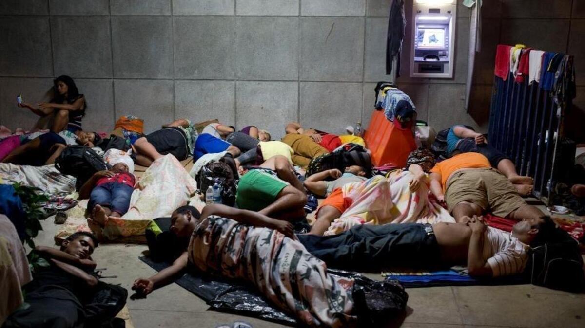 Cuban migrants were photographed in November outside the border control building in Penas Blancas, Costa Rica, after Nicaragua closed its borders to Cuban migrants. Nine Latin American governments on Monday charged that U.S. policy toward Cuban migrants has created a humanitarian crisis for the region.
