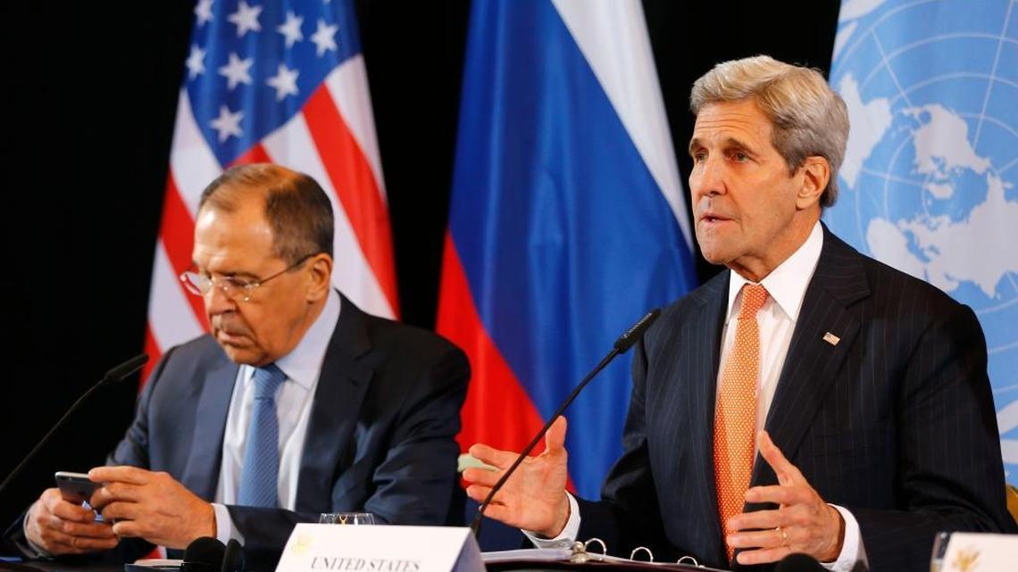 U.S. Secretary of State John Kerry, right, and Russian Foreign Minister Sergey Lavrov announce an agreement for a possible cease-fire early Friday, Feb. 12, 2016, in Munich.