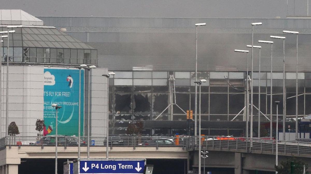 Smoke billows from the Zaventem Airport after a controlled explosion, in Brussels, Tuesday, March 22, 2016.