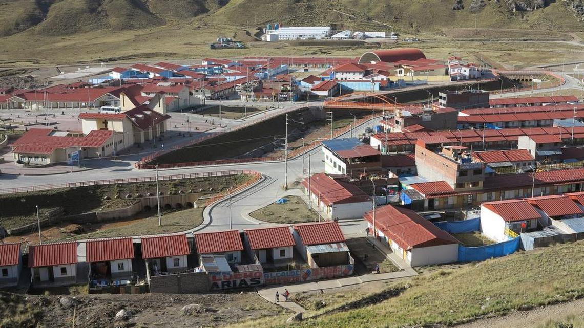 The planned community of Nueva Morococha was built in a high Andean valley by the Aluminum Corporation of China to house miners and families displaced by an expanding copper mine. The town, seen here in a July 14, 2015, photo, has 1,050 homes as well as schools, clinics, a coliseum and parks. The shantytowns of Morococha Antigua are a few miles away.