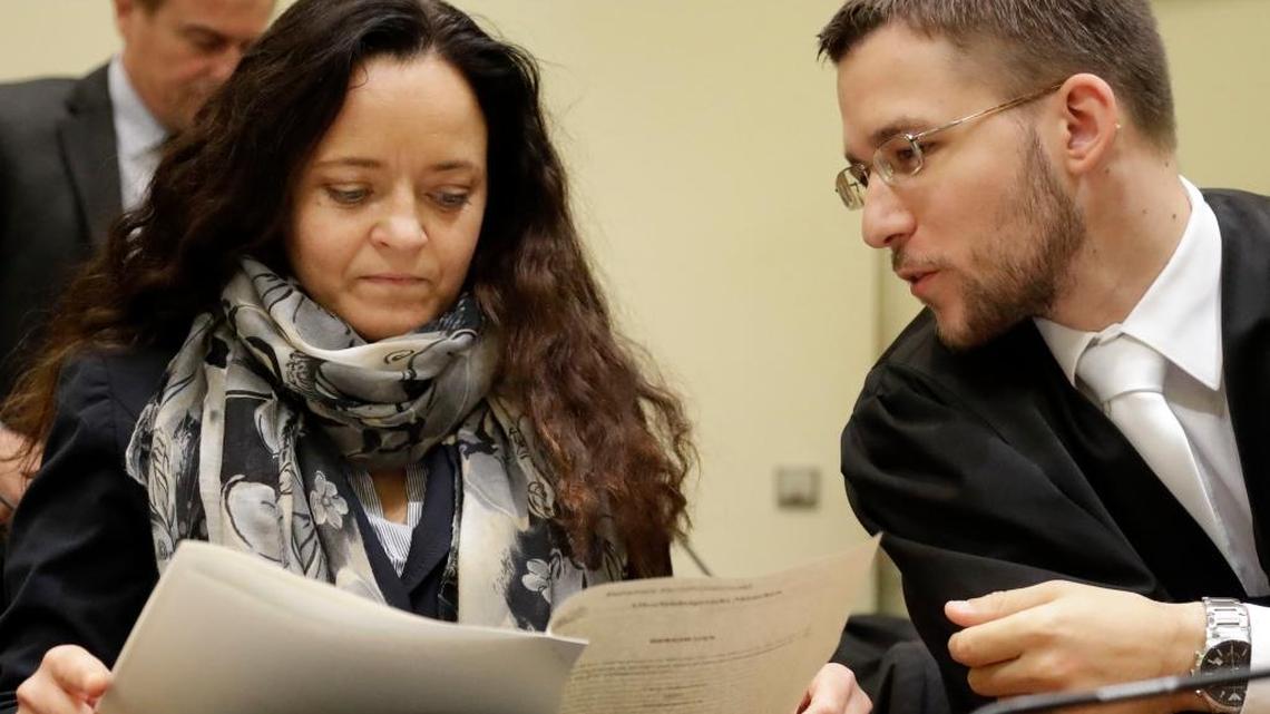 Terror suspect Beate Zschaepe arrives at the court room besides her lawyer Mathias Grasel in Munich, Germany, Thursday, Sept. 29, 2016. Zschaepe is accused of being involved in 10 neo-Nazi murders of the National Socialist Underground group, which allegedly killed eight Turkish men, a Greek and a policewoman between 2000 and 2007.