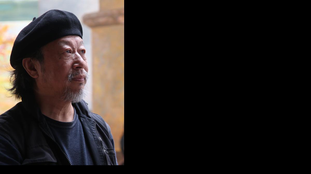 
In this picture taken Thursday, Jan. 29, 2015, Chinese-Australian artist Jiawei Shen studies on of his works in his studio in Bunbeena, Australia. Artist Shen Jiawei's paintings of Chinese soldiers during the Cultural Revolution were so popular with Mao's regime that 250,000 copies of his most famous work were made into propaganda posters and distributed throughout the country. Four decades later, Shen now has a different patron commissioning his work: He has become, somewhat inexplicably, the unofficial portrait artist of the Vatican. He painted the first official portrait of Pope Francis and recently completed a huge rendition of the second most powerful man in Rome, Cardinal George Pell, the Vatican's money guy. 
