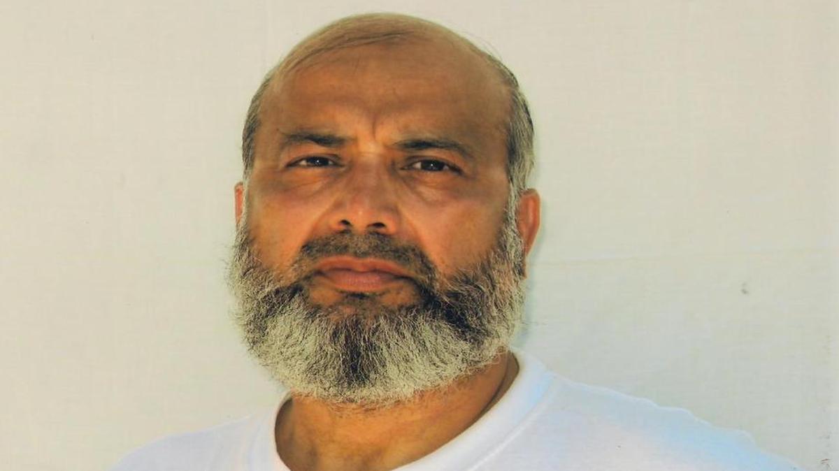 Saifullah Paracha poses for the International Red Cross at the U.S. Navy base at Guantánamo Bay, Cuba. This photo is courtesy the Paracha family via attorney David Remes.