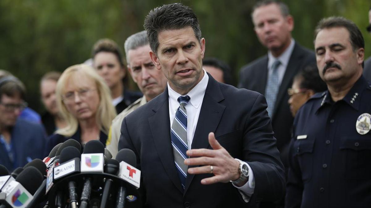 David Bowdich, center, assistant director of the FBI's Los Angeles office, talks to reporters during a news conference on Friday, Dec. 4, 2015, in San Bernardino, Calif. The FBI said Friday it is officially investigating the mass shooting in California as an act of terrorism, while a U.S. law enforcement official said the woman who carried out the attack with her husband had pledged allegiance to the Islamic State group and its leader on Facebook.