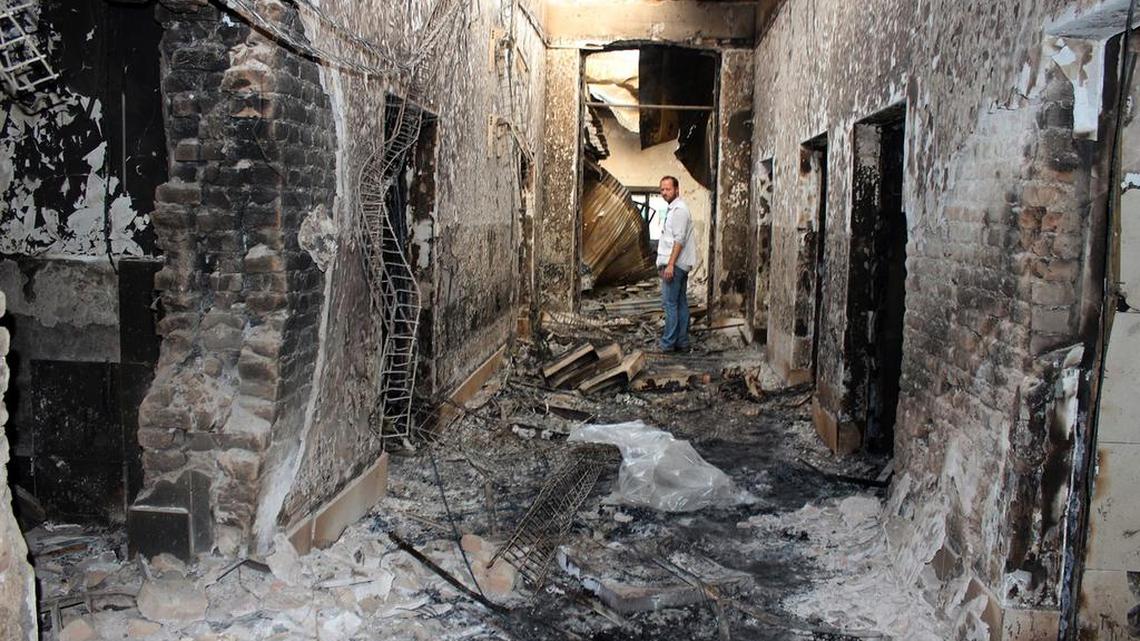 An employee of Doctors Without Borders stands inside the charred remains of their hospital after it was hit by a U.S. airstrike in Kunduz, Afghanistan. A dozen survivors interviewed by The Associated Press are convinced that the attack on the hospital, which treated wounded Taliban and government fighters alike, was no accident. They say it was sustained and focused on destroying the main hospital building, which the aid agency says “correlates exactly” with GPS coordinates it had given to all parties in the conflict.