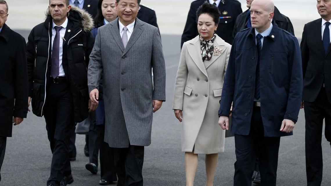 China’s President Xi Jinping, center left, and his wife, Peng Liyuan, center right, arrive at Orly airport, outside Paris, on Sunday, Nov. 29, 2015. More than 140 world leaders are gathering around Paris for high-stakes climate talks that start Monday, and activists are holding marches and protests around the world to urge them to reach a strong agreement to slow global warming.