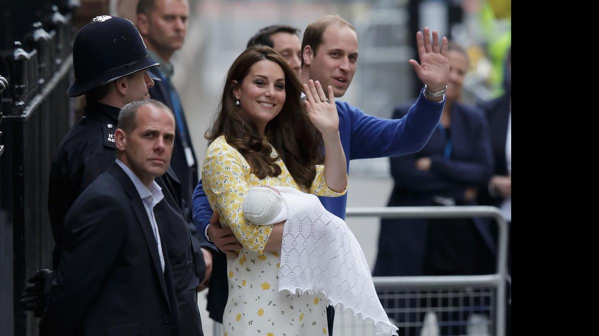 
Britain's Prince William and Kate, Duchess of Cambridge and their newborn baby princess, wave to the public as they leave St. Mary's Hospital's exclusive Lindo Wing in London, Saturday, May 2, 2015. 

