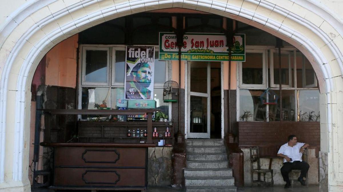 A restaurant worker sat outside his closed restaurant along the Malecon seafront in Havana, Monday, Nov. 28, 2016. The government declared a nine-day mourning period after the death of former leader Fidel Castro and banned the sale of alcohol, although some private and state-run restaurants catering to tourists are still serving beer, wine and spirits.