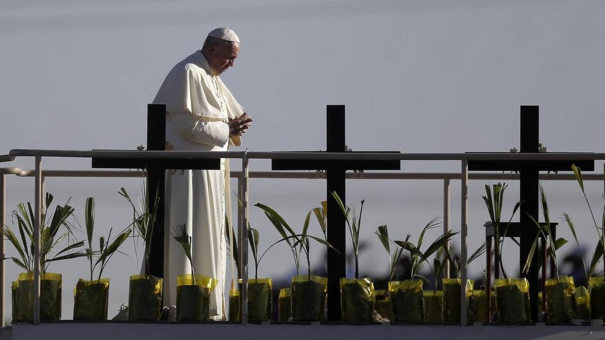 Pope Francis stands a platform near the U.S.-Mexico border fence along the Rio Grande, in Ciudad Juarez, Mexico, on Feb. 17, 2016. (AP Photo/Eric Gay)