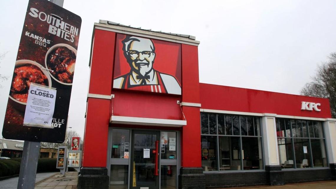 A KFC employee is charged after throwing a fire extinguisher and other kitchen items during a dispute over food preparation, Tennessee police say.