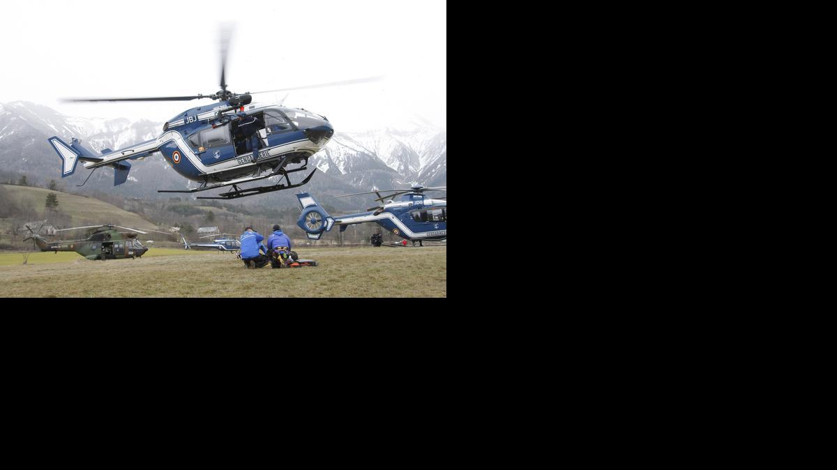 
An helicopter takes off at Seyne les Alpes, French Alps, Tuesday, March 24, 2015. A Germanwings passenger jet carrying at least 150 people crashed Tuesday in a snowy, remote section of the French Alps, sounding like an avalanche as it scattered pulverized debris across the mountain. 
