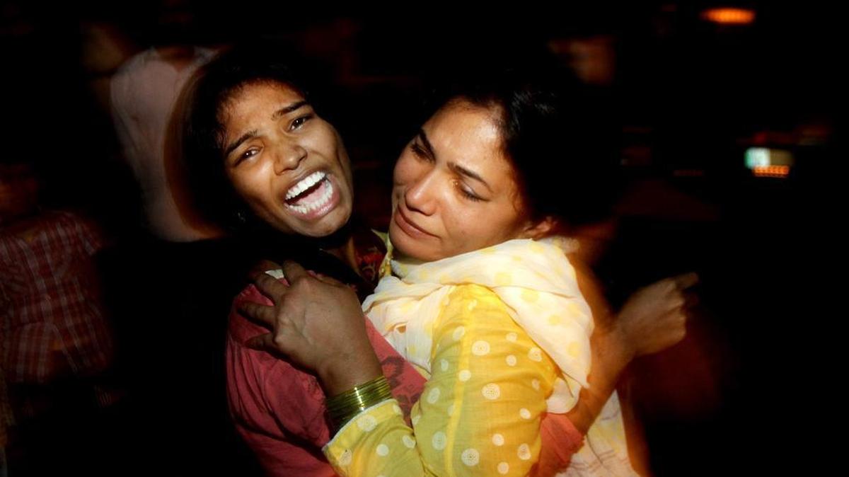 Women comfort each other at a local hospital in Lahore, Pakistan, as they mourn over the death of a family member who was killed on Sunday, March, 27, 2016, in a bomb blast that has killed at least 44 and wounded at least 91, a health official said.