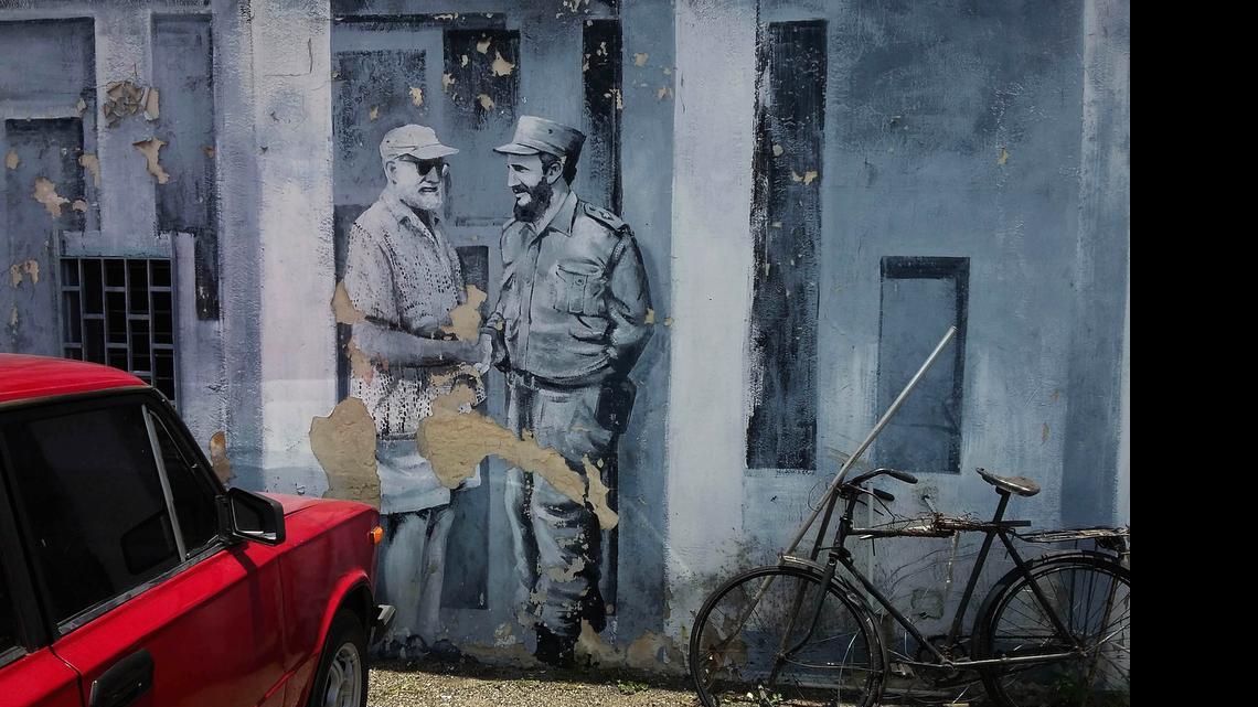 
A mural of author Ernest Hemingway and Fidel Castro shaking hands covers a downtown parking lot in Havana, Cuba, Monday, June 22, 2015. Cuban architects, engineers and workmen will construct a two-story laboratory where thousands of photos, books and letters to and from Hemingway can be treated and preserved. 
