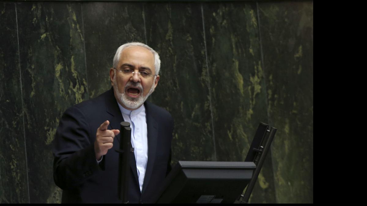 
Iranian Foreign Minister Mohammad Javad Zarif, who is also Iran’s top nuclear negotiator, addresses an open session of parliament in Tehran, Iran, on Tuesday, July 21, 2015. Iran's foreign minister has handed over the landmark nuclear deal reached with world powers last week to the country's parliament so that Iranian lawmakers can review it, state media said Tuesday. 
