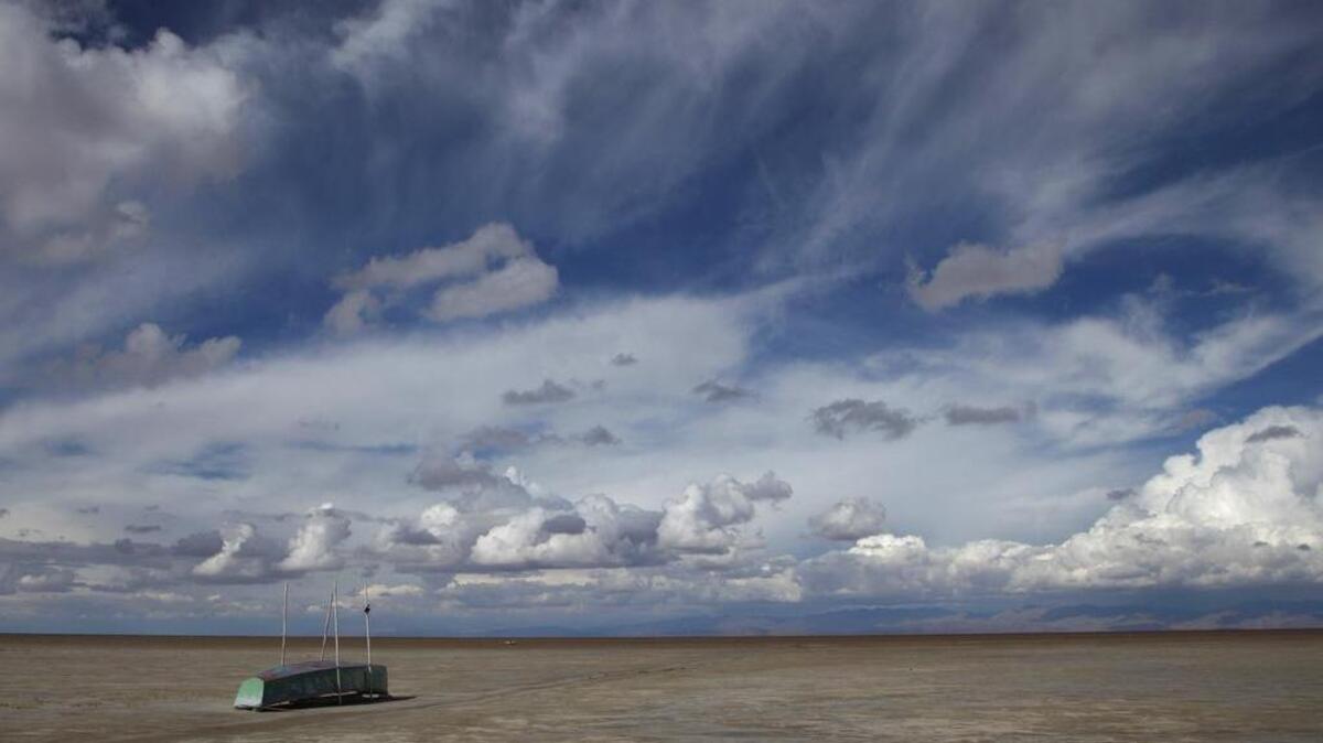 An abandoned boat lies on the dried up lake bed of Lake Poopo, on the outskirts of Untavi, Bolivia. Drought caused by the recurrent El Nino meteorological phenomenon is considered the main driver of the lake's demise. Along with glacial melting, authorities say another factor is the diversion of water from Poopo’s tributaries, mostly for mining but also for agriculture.