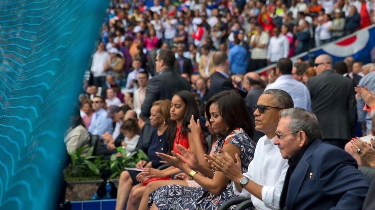 President Barack Obama, with his family, and Cuban leader Raul Castro attend a exhibition baseball game between the Tampa Bay Rays and the Cuban National team at the Estadio Latinoamericano, Tuesday, March 22, 2016, in Havana.