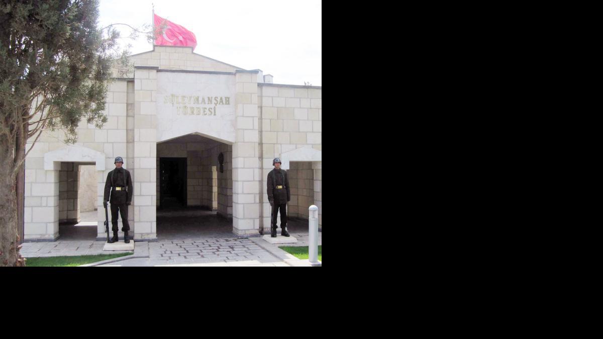 
In this April 7, 2011, photo, Turkish soldiers stand guard at the entrance of the memorial site of Suleyman Shah, grandfather of Osman I, founder of the Ottoman Empire, in Karakozak village, northeast of Aleppo, Syria. Turkey’s state-run TRT television broadcaster reported early Sunday, Feb. 22, 2015, that Turkey launched the operation overnight to evacuate troops guarding an Ottoman tomb in Syria, just over the border near the town of Kobani.
