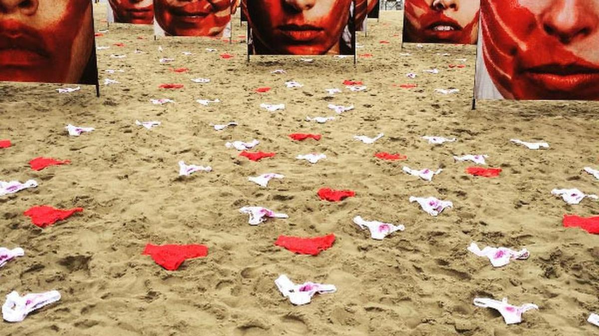 Protesters display 420 pairs of red and white women’s underwear on Copacabana beach in Rio de Janeiro.