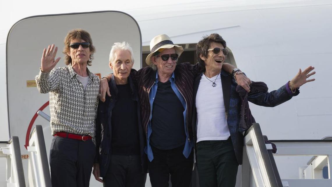 Members of The Rolling Stones, from left, Mick Jagger, Charlie Watts, Keith Richards and Ron Wood pose for photos from the plane that brought them to Cuba at Jose Marti international airport in Havana, Cuba, Thursday. The Stones are performing a free concert in Havana on Friday, becoming the most famous act to play Cuba since its 1959 revolution.
