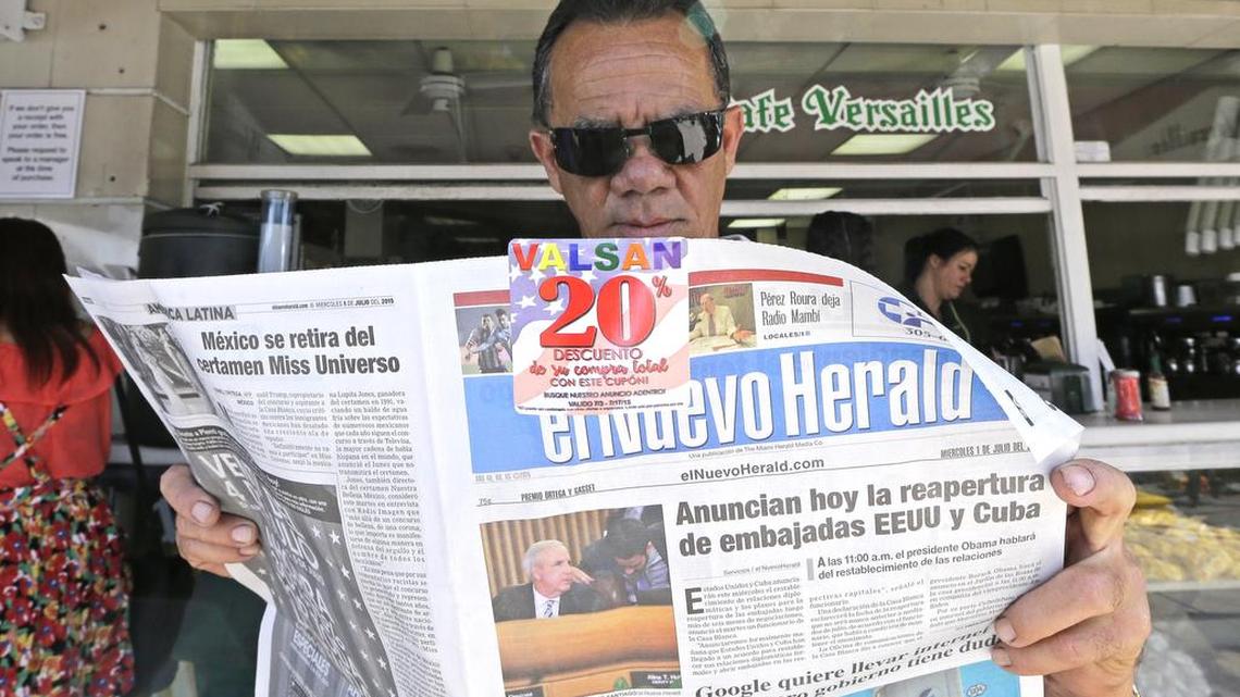 
Francisco Gil reads the announcement of the reopening of embassies in Havana and Washington, Wednesday, July 1, 2015, in the Little Havana area of Miami. President Barack Obama has moved this year to usher in a new chapter in relations between the U.S. and Cuba after a half-century of hostility.

