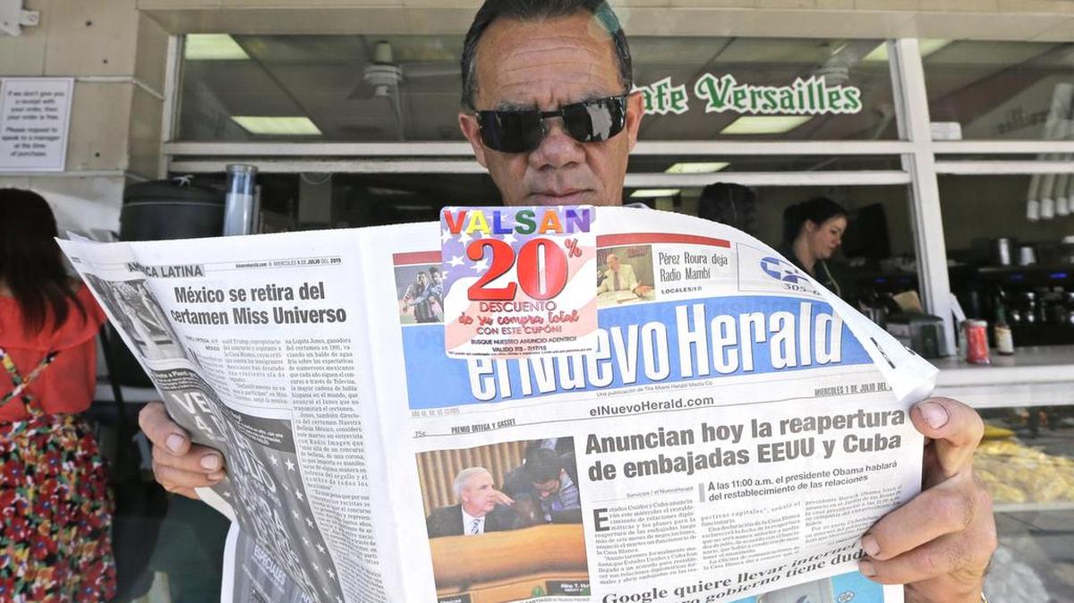 
Francisco Gil reads the announcement of the reopening of embassies in Havana and Washington, Wednesday, July 1, 2015, in the Little Havana area of Miami. President Barack Obama has moved this year to usher in a new chapter in relations between the U.S. and Cuba after a half-century of hostility.
