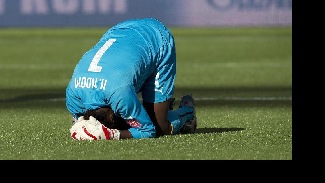 
Cameroon goalkeeper Annette Ngo Ndom (1) holds her head after being injured against China during second-half FIFA Women's World Cup soccer game action in Edmonton, Alberta, on Saturday, June 20, 2015.
