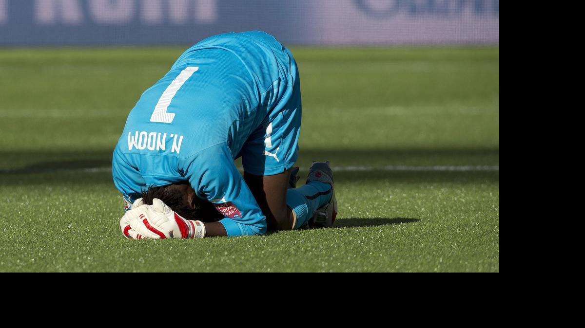 
Cameroon goalkeeper Annette Ngo Ndom (1) holds her head after being injured against China during second-half FIFA Women's World Cup soccer game action in Edmonton, Alberta, on Saturday, June 20, 2015.
