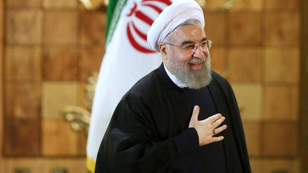 Iran’s President Hassan Rouhani gestures on Sunday, Jan. 17, 2016, at the conclusion of his press conference in Tehran. The implementation of a historic nuclear deal with world powers is expected to pave the way for a new economic reality in Iran, now freed from harsh international sanctions. On Sunday Rouhani presented parliament with a draft budget that plans for an economic windfall even as it reduces reliance on oil revenues.