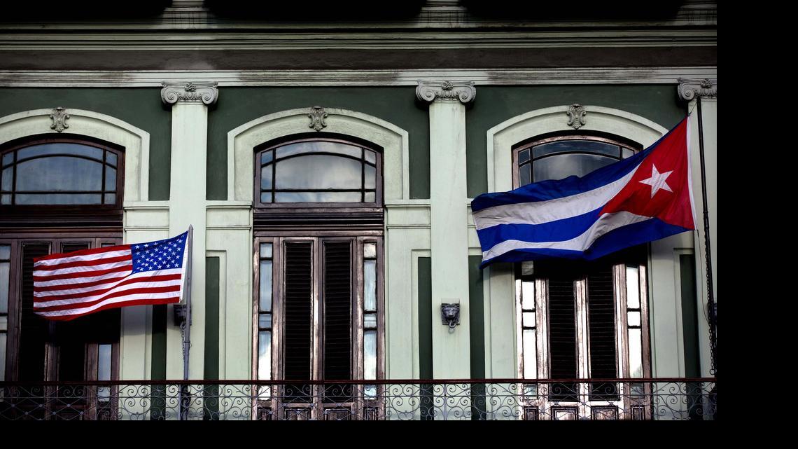 
A Cuban and American flag wave from the balcony of the Hotel Saratoga in Havana. President Barack Obama will announce July 1 that the U.S. and Cuba have reached an agreement to open embassies in Havana and Washington, a senior administration official said. 
