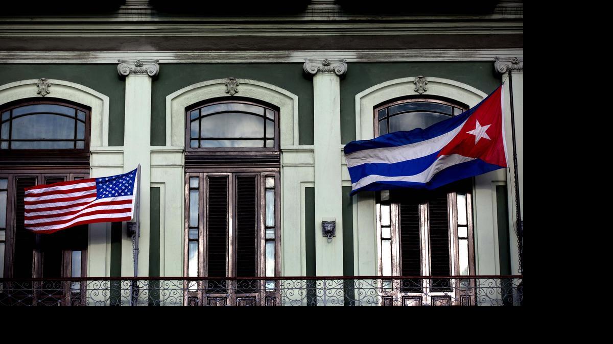 
A Cuban and American flag wave from the balcony of the Hotel Saratoga in Havana. President Barack Obama will announce July 1 that the U.S. and Cuba have reached an agreement to open embassies in Havana and Washington, a senior administration official said. 
