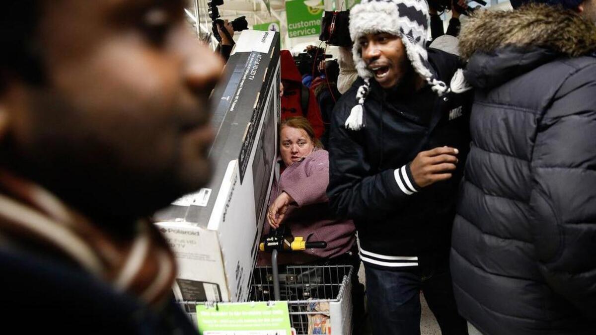 Customers scramble for Black Friday deals at an Asda supermarket in London on Nov. 28, 2014.