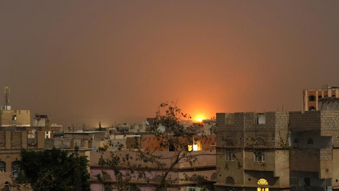 An explosion is seen after a Saudi-led airstrike hit a site believed to be one of the largest weapons depot on the outskirts of Yemen's capital, Sanaa, on Saturday July 4, 2015. The Saudi-led coalition launched air raids in the capital, Sanaa, targeting the homes of Shiite rebels and their allies, as well as other sites across the country.