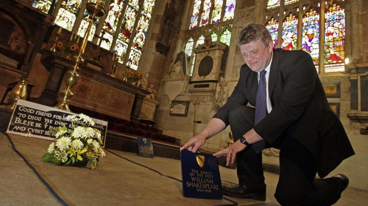 Head Verger Jon Ormrod tends to the grave of William Shakespeare in the Chancel of Holy Trinity Church in Stratford-upon-Avon, England, in 2009. Archeologists who scanned the grave of William Shakespeare say they have made a startling discovery: His skull appears to be missing. The researchers used ground-penetrating radar to explore beneath the playwright's tomb in Stratford-upon-Avon's Holy Trinity Church.