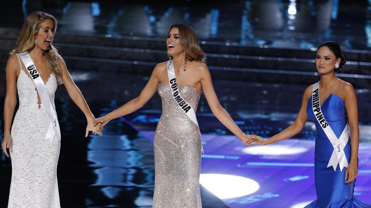 From left, Miss USA Olivia Jordan, Miss Colombia Ariadna Gutierrez and Miss Philippines Pia Alonzo Wurtzbach react as they make the final three at the Miss Universe pageant Sunday, Dec. 20, 2015, in Las Vegas.